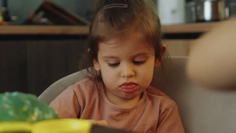 Kid playing with hand made toy slime. Funny kid girl and boy. Stress relief Stock Footage 269348960