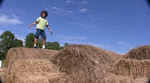 Kid Playing On Haystack In Texas Video stock 10586568