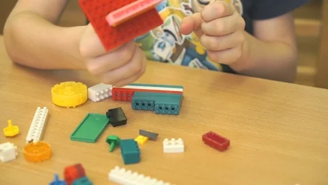 Kid playing intellectual game with the designer 스톡 동영상 71314204