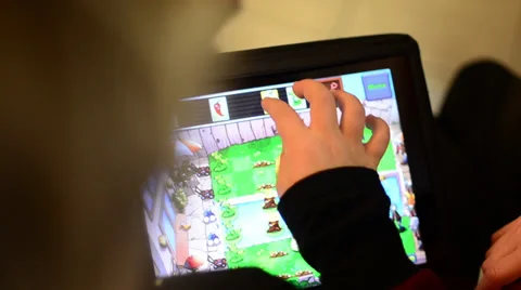 Kid playing ipad game Stock Footage 31898453
