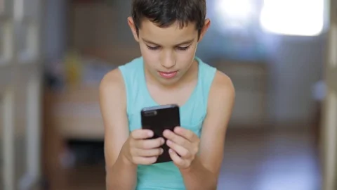 Kid playing mobile game  Stock Footage 111970590