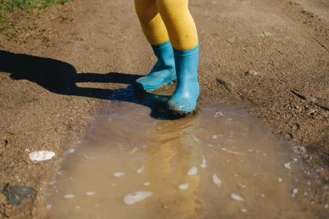 Kid playing in mud Stock Photos
