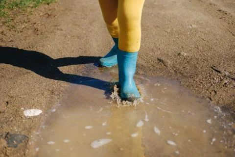Kid playing in mud Stock Photos