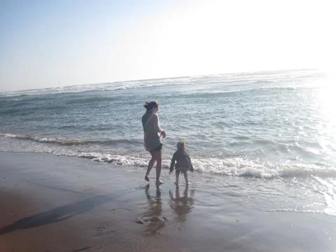 Kid playing in Ocean Stock Photos