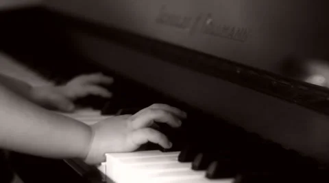 Kid playing piano Stock Footage 32876406