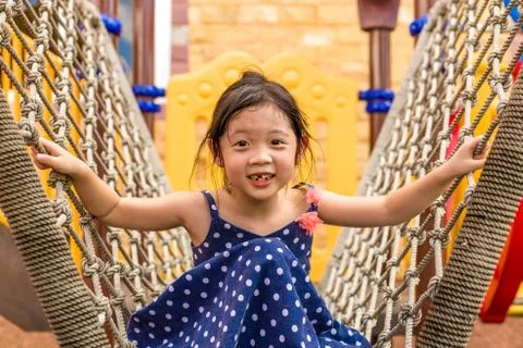 Kid Playing on Playground Stock Photos