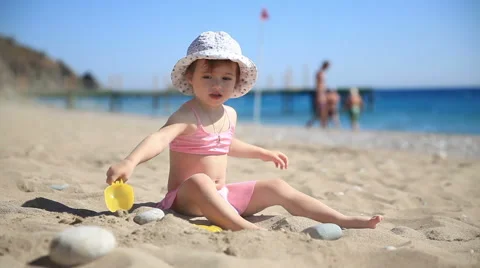Kid playing with sand on the beach. Stock Footage 42648744