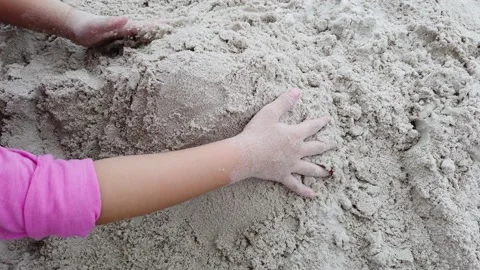 Kid is playing sand at the beach. Stock Footage 134384432
