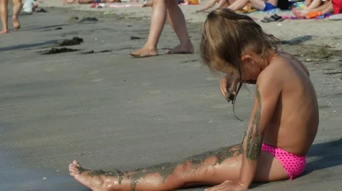 Kid playing sand on the sandy beach, seashore Stock Footage 68263866