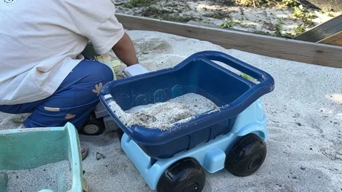 A kid playing in the sand. Slow motion Video stock 206756842