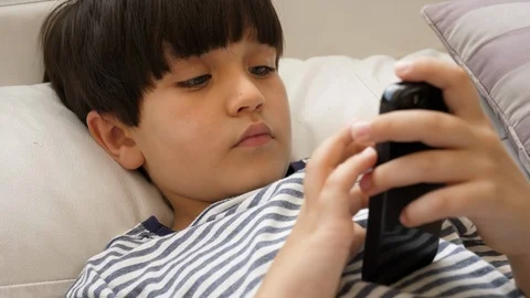 Kid playing with Smartphone Stock-Footage 88908895