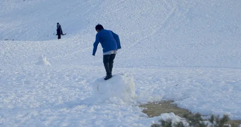 Kid Playing with the Snowball. Stock Footage 105138426