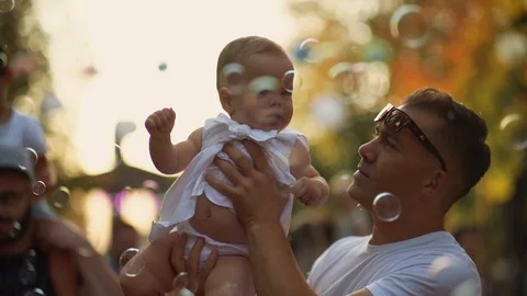 Kid Playing with Soap Bubbles Summer time Stock Footage 127626618