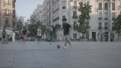 Kid playing soccer in Madrid Stock Footage 245238441