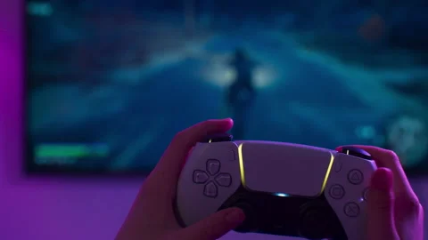 Kid playing Sony playstation 5 on TV screen, man play on next gen console at Stock Footage 144580680