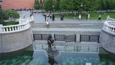 Kid playing on a statue Stock Footage 90099514