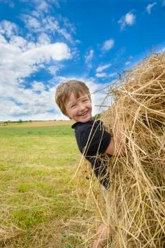 Kid playing with straw Stock Photos