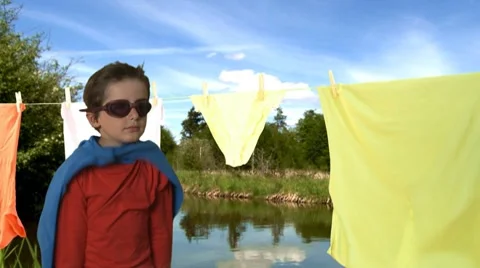 Kid playing super hero Stock Footage 8621343