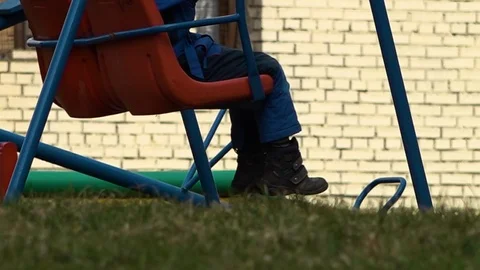 Kid playing on the swing Stock Footage 92382990