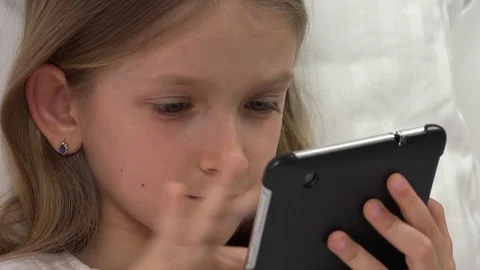 Kid Playing Tablet in Bed, Child Browsing Internet on Touchscreen Smartphone Stock Footage 76093345