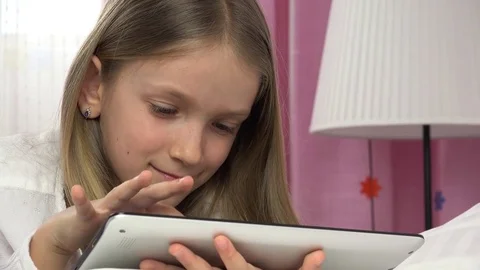 Kid Playing Tablet in Bed, Child Browsing Internet on Touchscreen Smartphone Stock Footage 80081857