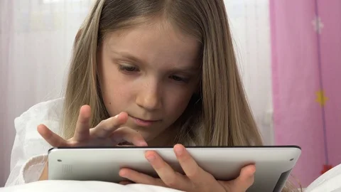 Kid Playing Tablet in Bed, Child Browsing Internet on Touchscreen Smartphone Stock Footage 86681516