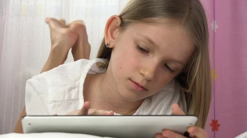 Kid Playing Tablet in Bed, Child Browsing Internet on Touchscreen Smartphone Stock Footage 98883072