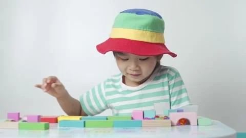 Kid playing toy blocks. 스톡 동영상 194383755