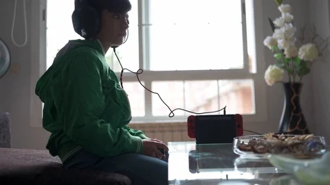 Kid playing with a video game console at home Stock Footage 116270434