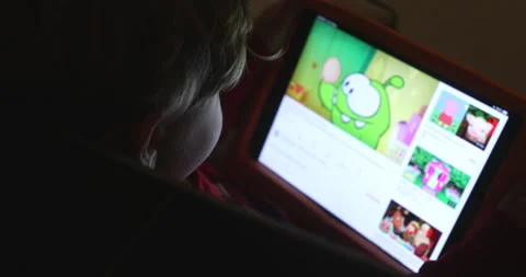 Kid playing witg a tablet Stock Footage 168116242