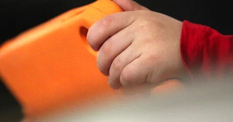 Kid playing witg a tablet Stock Footage 168116312