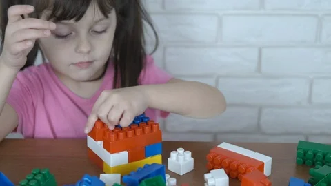 The kid plays with the designer. Stock-Footage 102604456