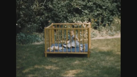 A kid plays inside the Crib - 1949 Stock Footage 106242363