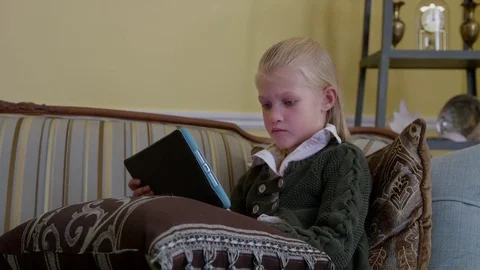 Kid Plays on iPad tablet - Dolly - Close Up Stock Footage 70006482