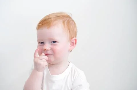 The kid points to a scratch Stock Photos