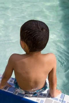 Kid in pool Stock Photos