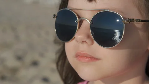 Kid pose in sunglasses. Stock Footage 120390600