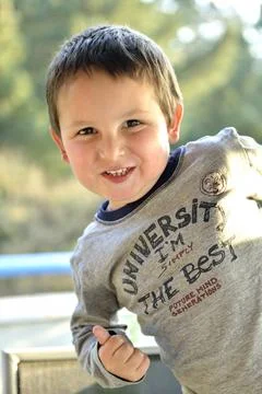 Kid posing for the camera Stock Photos