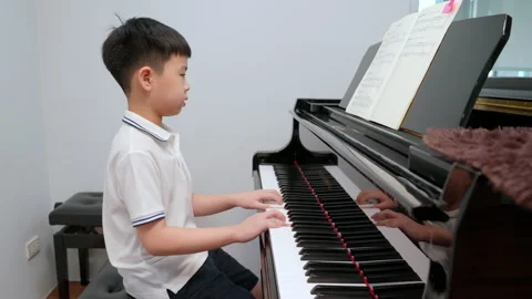 Kid practice piano Stock Footage 201725749
