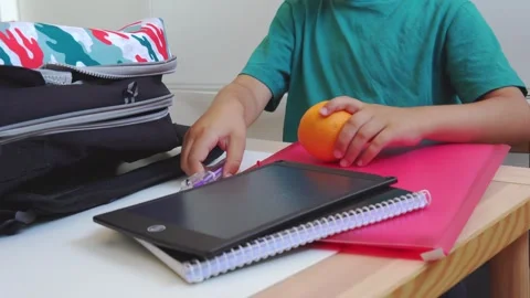 Kid preparing backpack in a rush  to go to schoolc Stock Footage 279337841