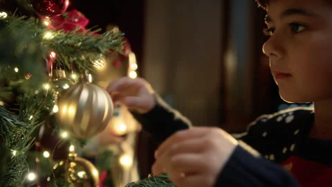Kid preparing tree for Christmas with decorations Stock Footage 255784970