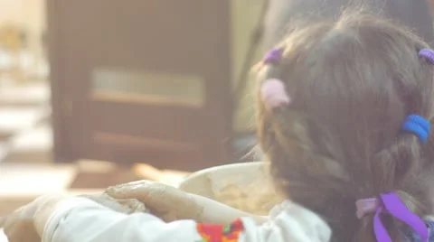 Kid is Pressing a Clay Circle Kid's Head Close Up Sculpting a Vase Little Stock Footage 59128258