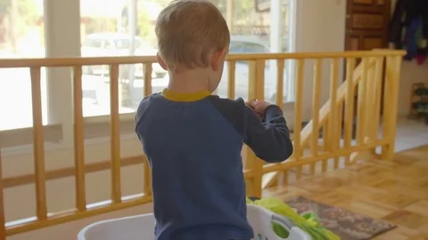 Kid pretends to dress up Stock Footage 76547226