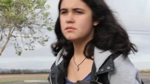 Kid puts book in backpack and leaves school Stock Footage 155388647