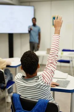 Kid Raising Hand in Class Stock Photos