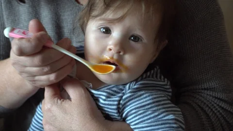 The kid refuses to eat from a spoon of mashed potatoes Stock Footage 124211159