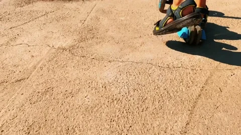Kid riding a scooter Stock Footage 196179890