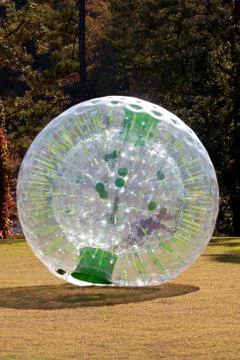 Kid Rolling Inside Large Zorb Stock Photos