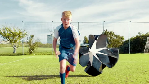 Kid, running and soccer practice on field with parachute, strength training and Stock Footage 309417477