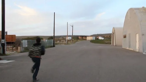 Kid runs by moving camera Stock Footage 114215297
